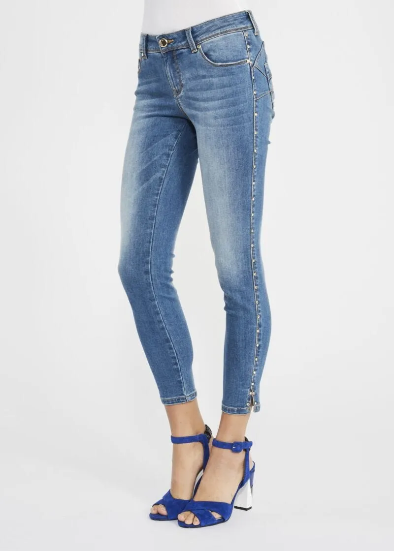 Jeans skinny con rivetti