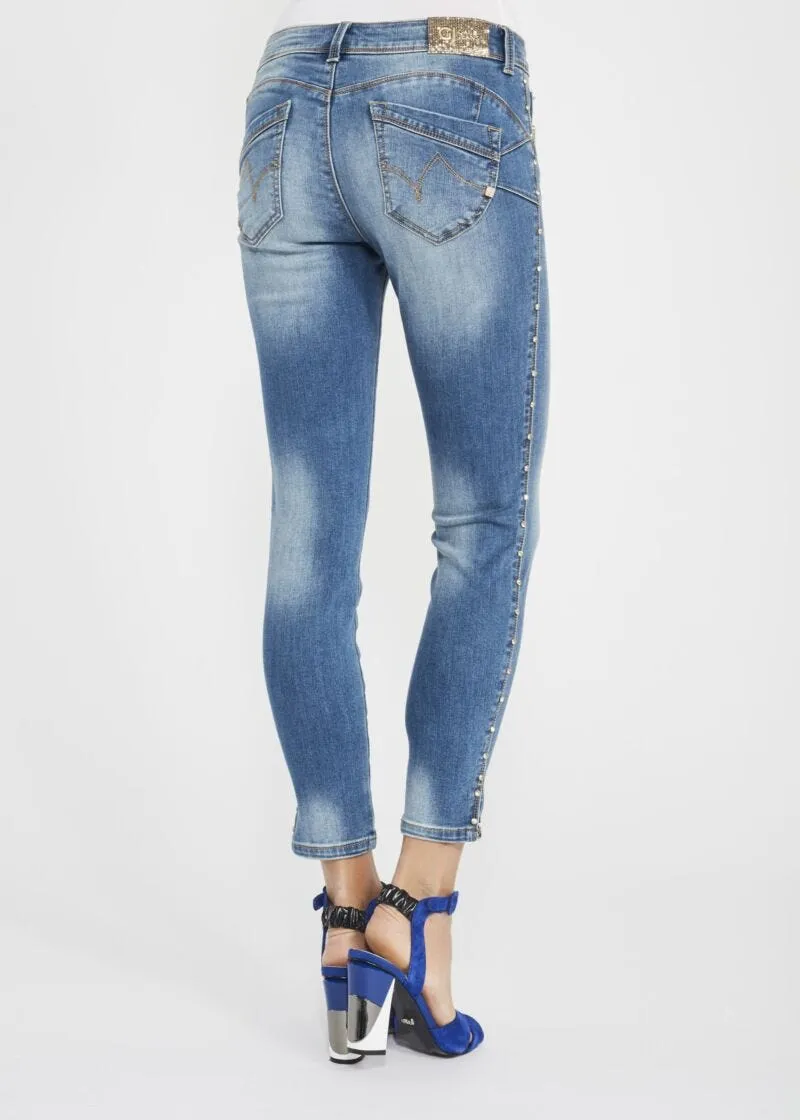 Jeans skinny con rivetti