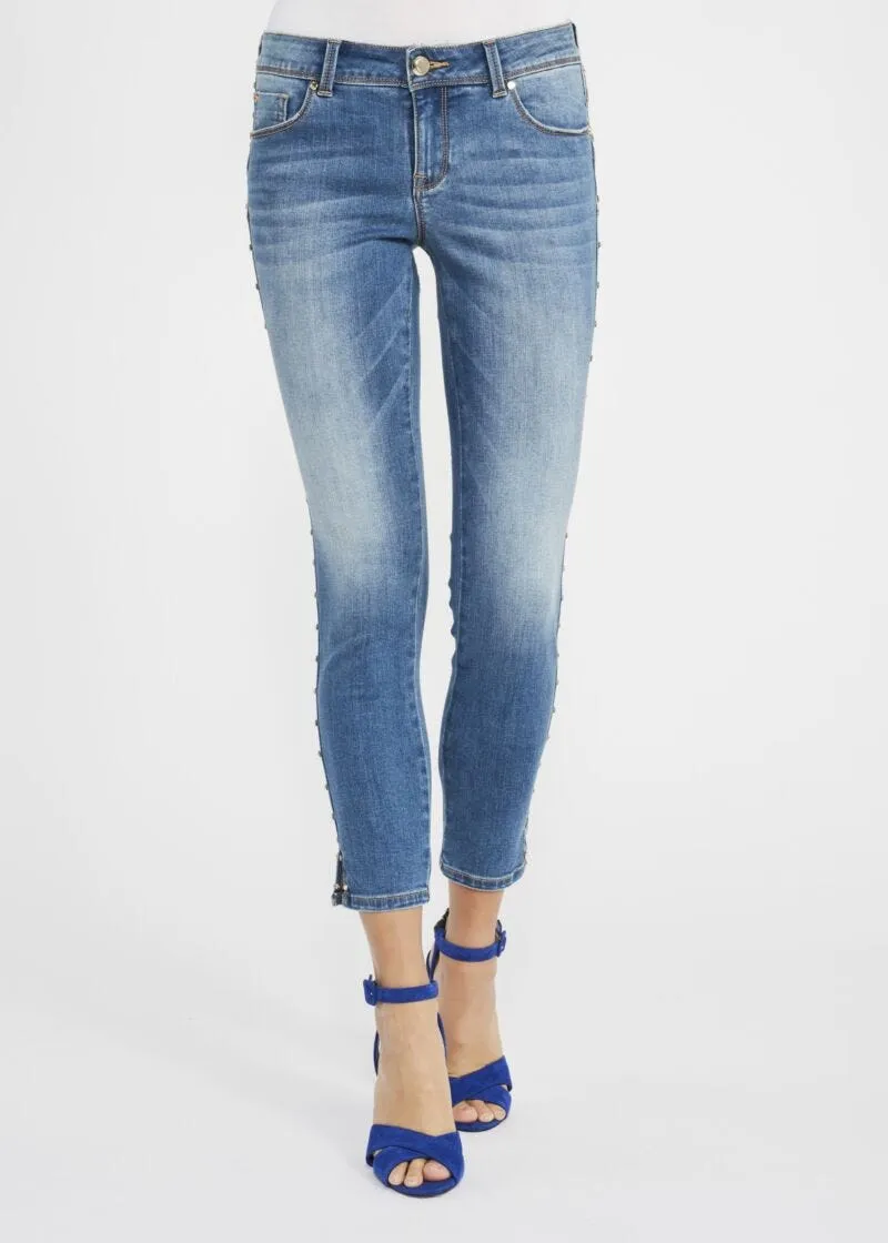 Jeans skinny con rivetti